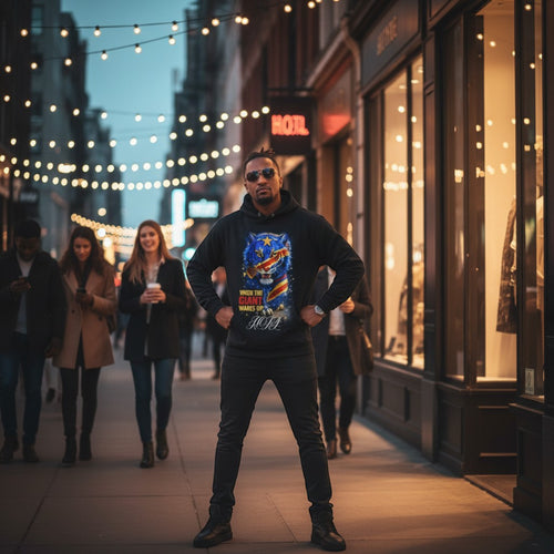 K&ChildrenBusiness black long sleeve hooded sweatshirt with a leopard graphic featuring the Congo flag colors and text "WHEN THE GIANT WAKES UP".