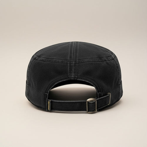 K&ChildrenBusiness distressed black military cap with adjustable strap and leather patch detail.