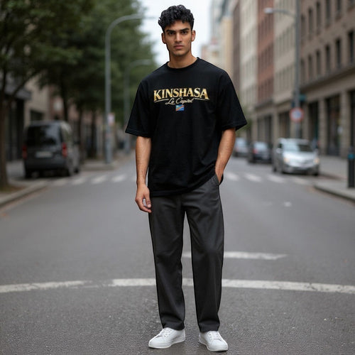 K&ChildrenBusiness black long-sleeve t-shirt with Kinshasa La Capital graphic and Congolese flag detail. Made from 60/40 cotton/polyester blend.